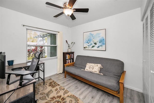 office space featuring ceiling fan and light wood-type flooring