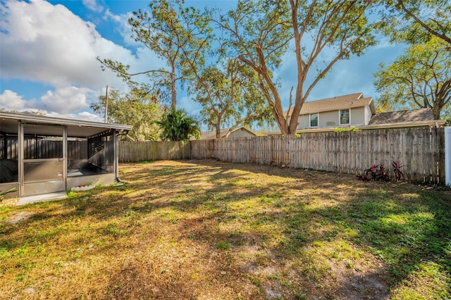 view of yard with a sunroom