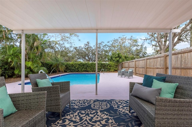 view of pool featuring an outdoor living space and a patio