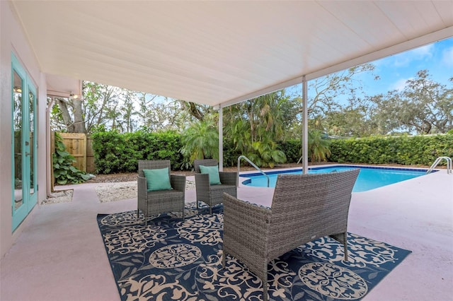 view of patio featuring a fenced in pool