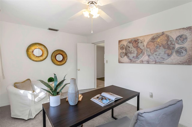 living room featuring ceiling fan and light carpet