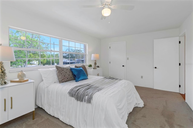 carpeted bedroom featuring ceiling fan