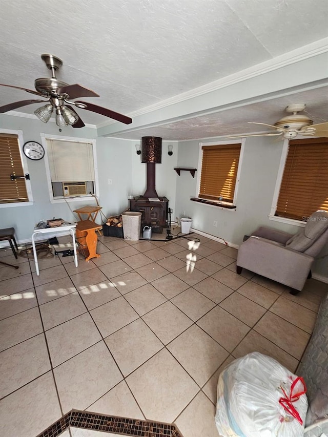 tiled living room with cooling unit, crown molding, a wood stove, and a textured ceiling