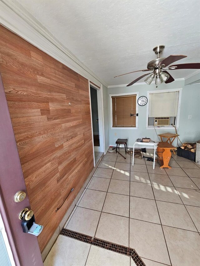 interior space with ceiling fan and cooling unit