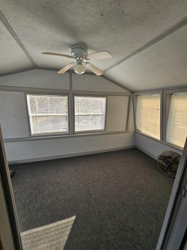 unfurnished sunroom featuring vaulted ceiling and ceiling fan