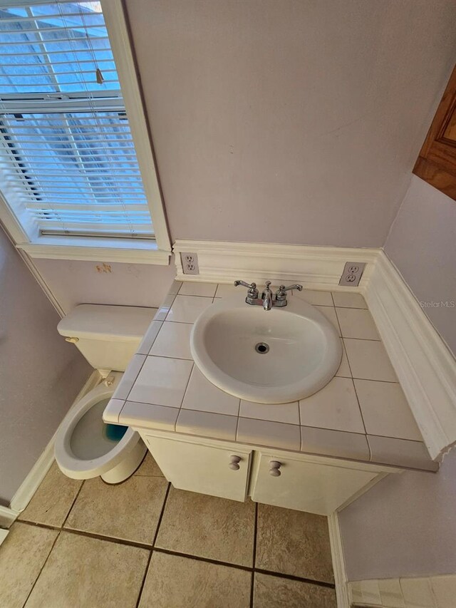 bathroom featuring tile patterned floors and sink