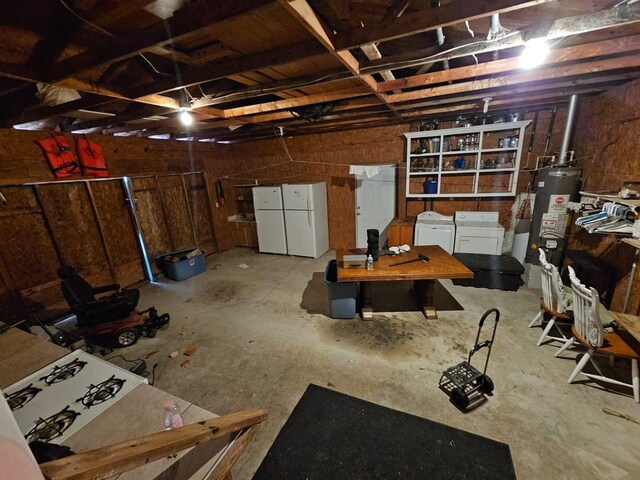 interior space featuring washer and dryer, white fridge, and water heater