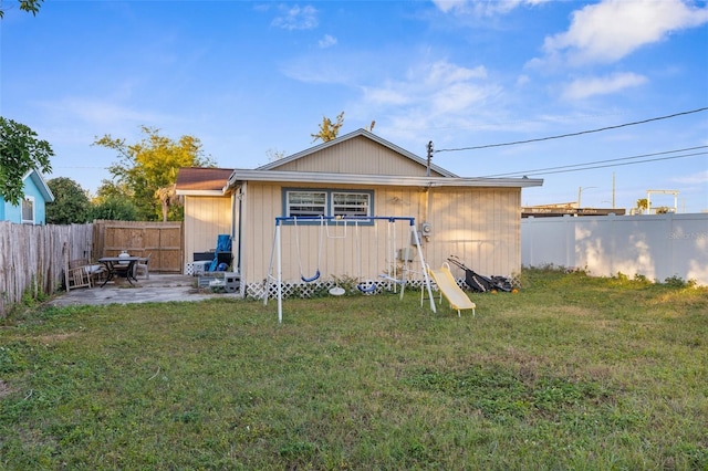 view of outbuilding with a yard