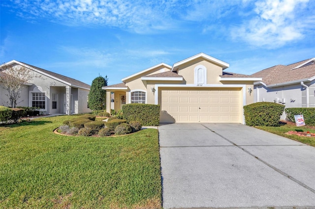 ranch-style house featuring a garage and a front yard