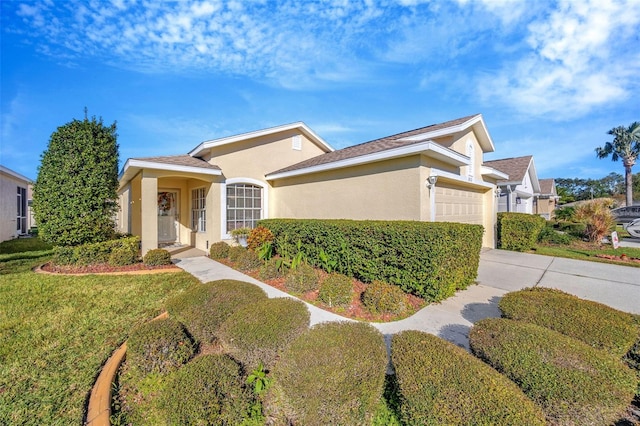 view of front facade with a front yard and a garage