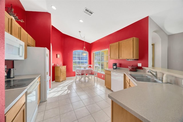 kitchen with pendant lighting, white appliances, sink, light tile patterned flooring, and kitchen peninsula