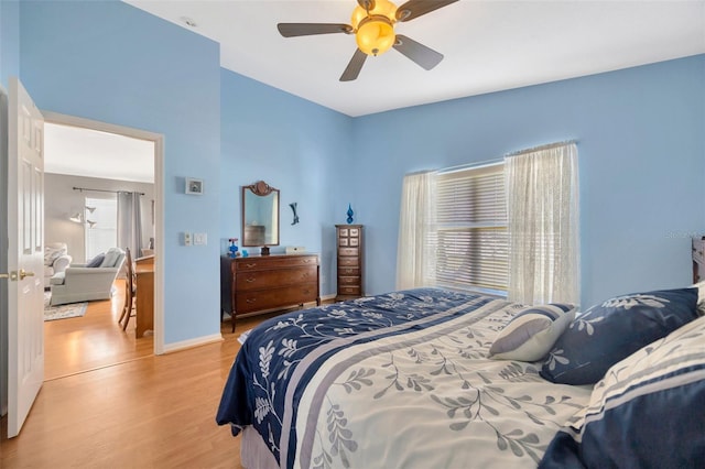 bedroom featuring light hardwood / wood-style flooring and ceiling fan