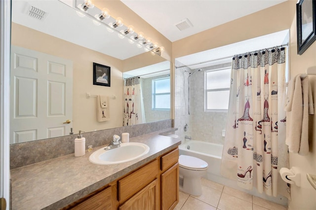 full bathroom with tile patterned flooring, shower / bath combination with curtain, toilet, and vanity