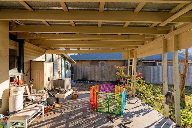 view of patio with a deck and central AC unit