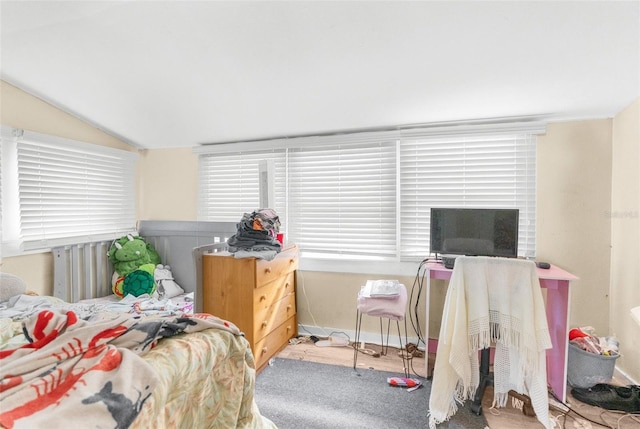 bedroom featuring lofted ceiling