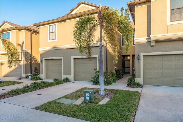 multi unit property featuring a garage