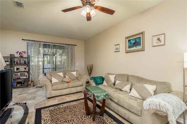 tiled living room featuring ceiling fan