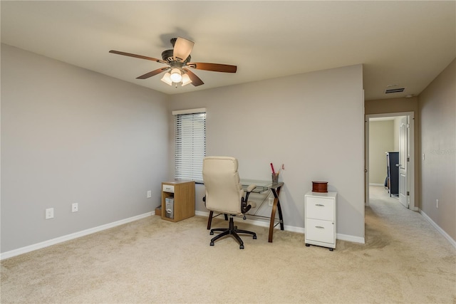 carpeted office with ceiling fan