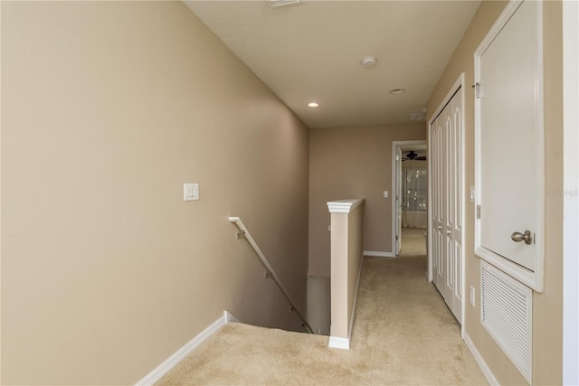 corridor with light colored carpet