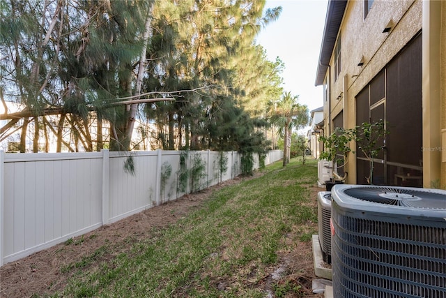 view of yard with central air condition unit