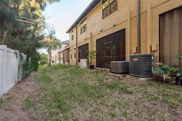 view of yard with central AC