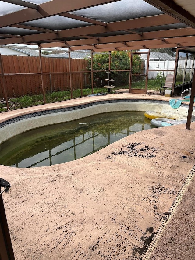 view of pool with a lanai