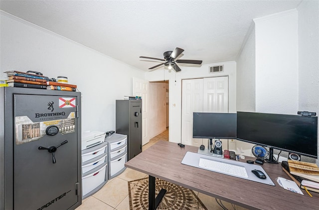 office area featuring light tile patterned floors, a textured ceiling, ceiling fan, and crown molding