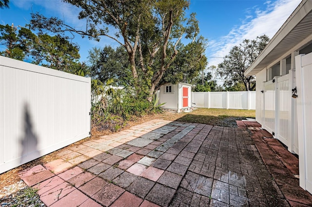 view of patio / terrace featuring a shed