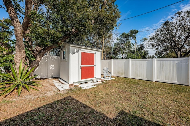 view of outbuilding featuring a lawn