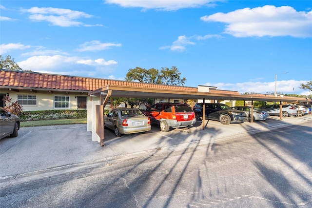 view of vehicle parking featuring a carport