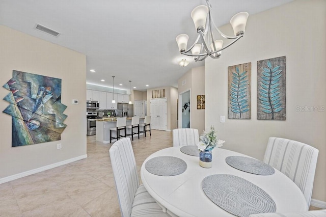 dining space featuring an inviting chandelier and light tile patterned floors