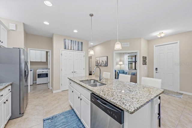 kitchen with sink, white cabinetry, decorative light fixtures, a center island with sink, and appliances with stainless steel finishes