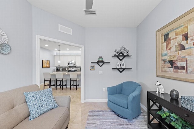 living room featuring light tile patterned flooring