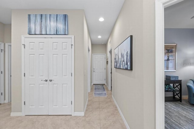 corridor featuring light tile patterned flooring