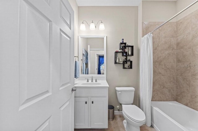 full bathroom featuring tile patterned flooring, shower / bath combo, vanity, and toilet