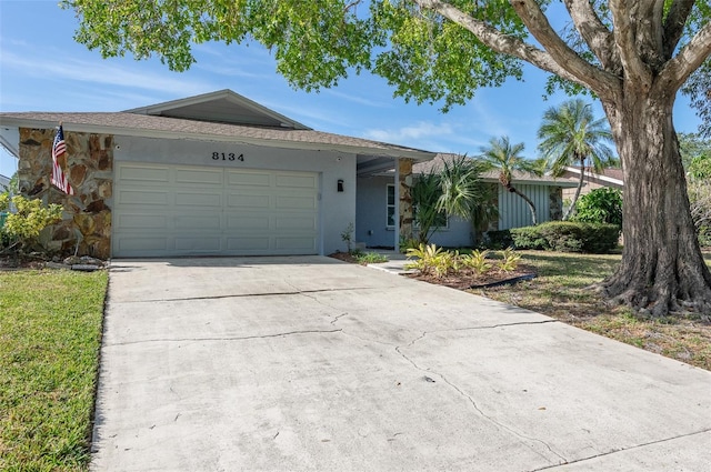 single story home featuring a garage