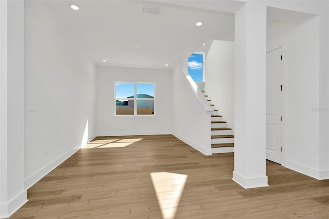 unfurnished living room with light wood-type flooring