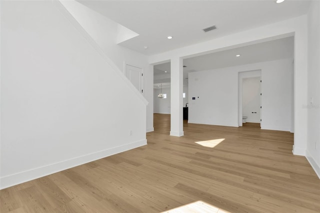 unfurnished living room with light hardwood / wood-style flooring