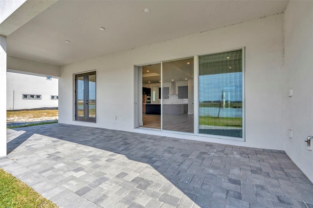 view of patio featuring french doors