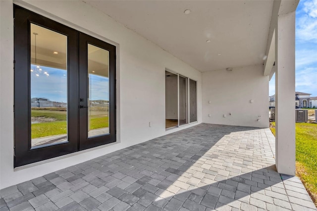 view of patio / terrace featuring central air condition unit and french doors