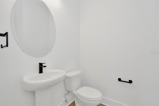 bathroom with toilet and sink