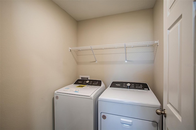 laundry room featuring washing machine and dryer