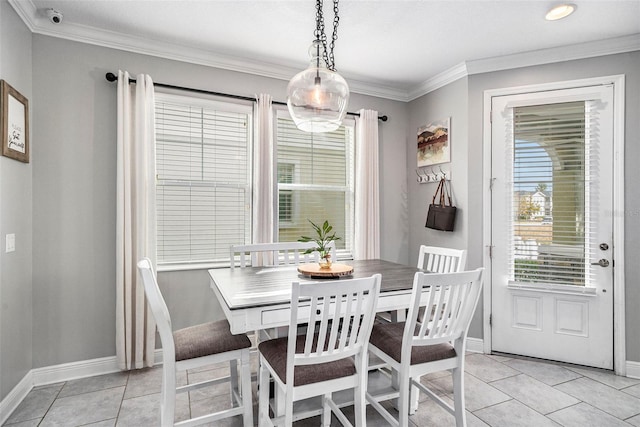 dining room featuring light tile patterned floors and crown molding