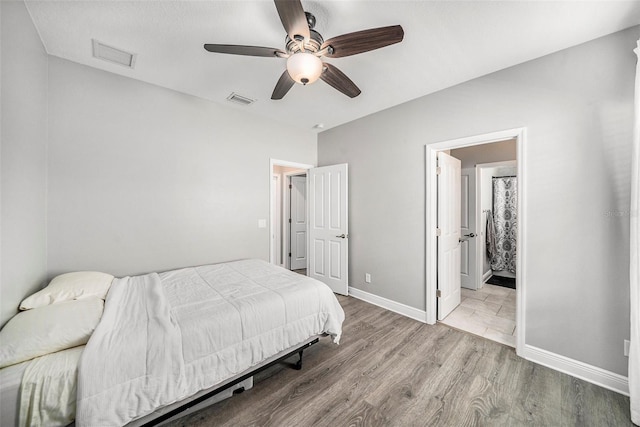 bedroom with ceiling fan and light wood-type flooring