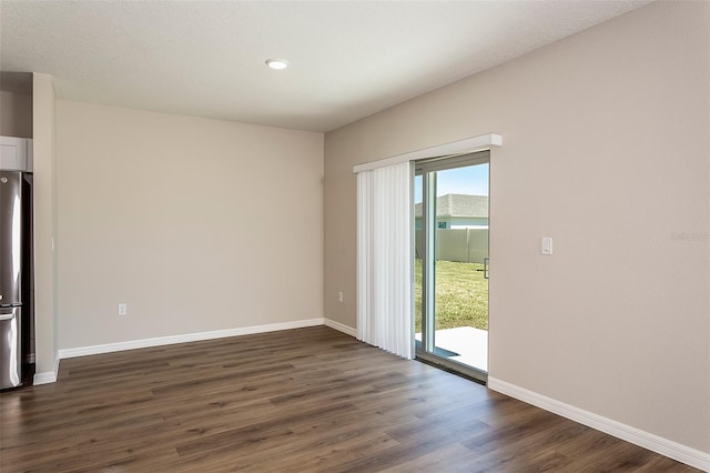 unfurnished room featuring dark hardwood / wood-style floors