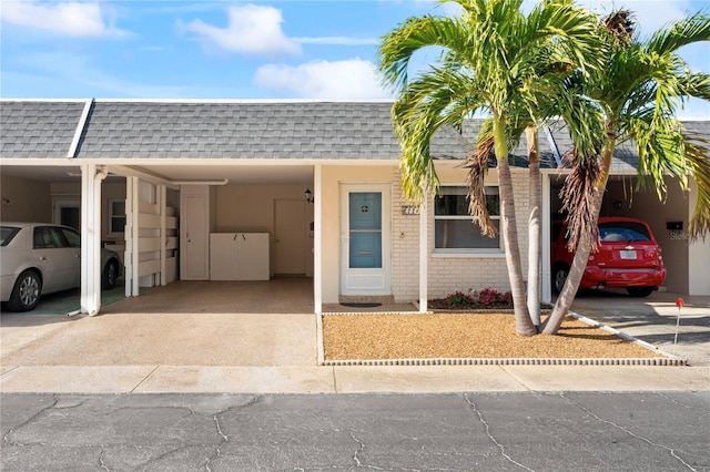 view of front of home featuring a carport