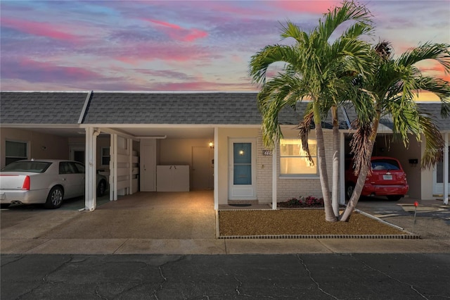 view of front of home with a carport