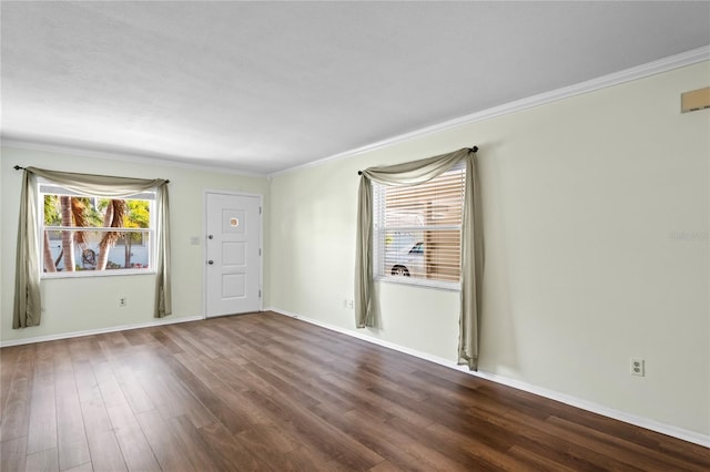 unfurnished room featuring hardwood / wood-style flooring and ornamental molding