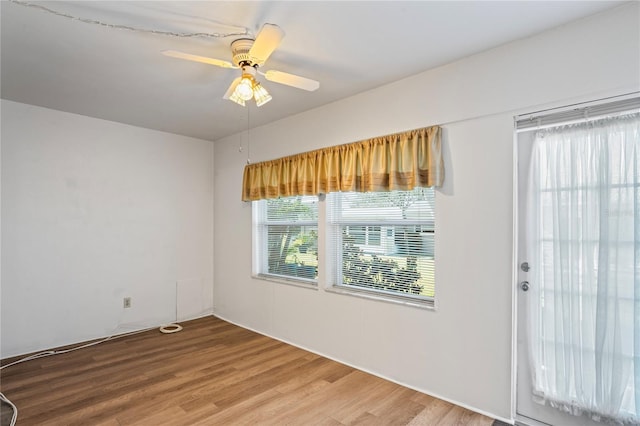 interior space with ceiling fan and hardwood / wood-style floors