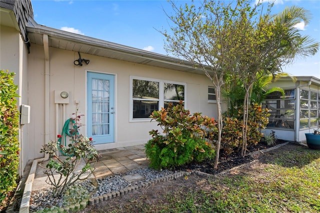 entrance to property with a patio